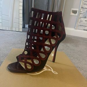 Burgundy and Black Christian Louboutin booties.